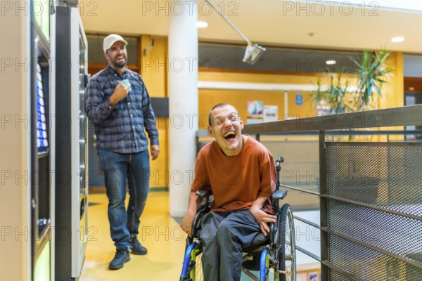 Man with cerebral palsy laughing next to coworker during a work break walking into vending machines