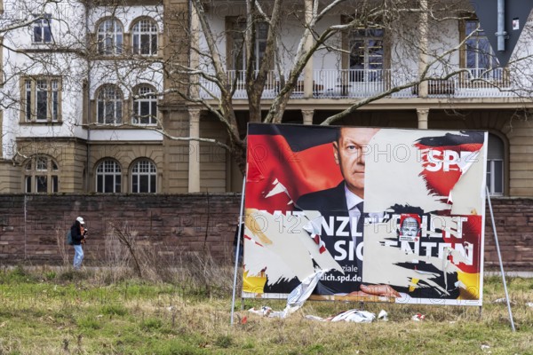 Election poster of the SPD party with Olaf Scholz for the Bundestag election 2025. BTW25. The large poster was destroyed by vandals, it is a symbol for the failed Federal Chancellor. Karlsruhe, Baden-Württemberg, Germany
