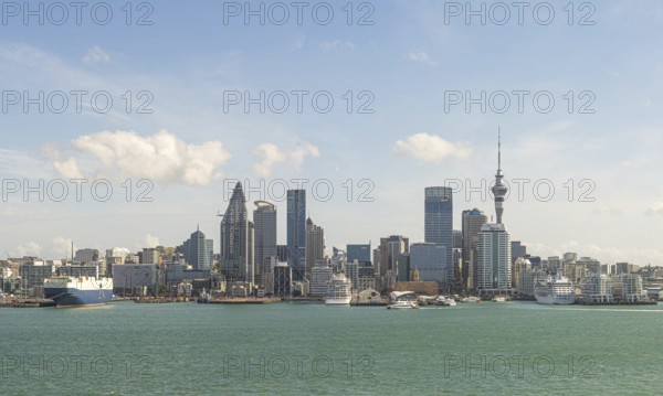 Skyline with modern skyscrapers and harbour against a blue sky Auckland, New Zealand, Oceania