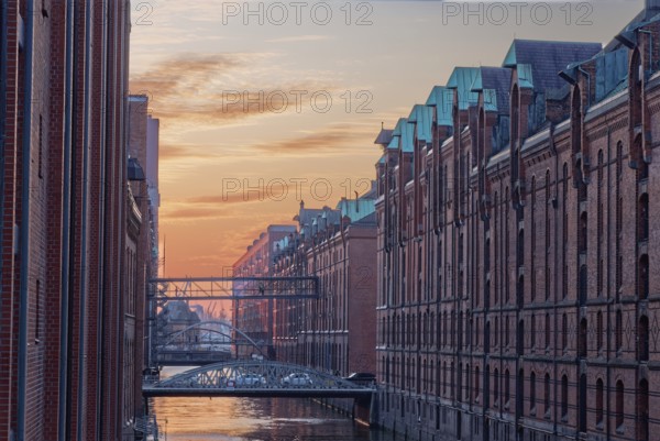 Speicher am Brooksfleet in Hamburg's Speicherstadt, UNESCO World Heritage Site, in front of the evening sky. Hamburg, Germany