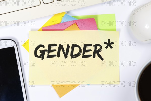 Gendering with gender stars as a symbol for gender-appropriate language Communication concept on desk in