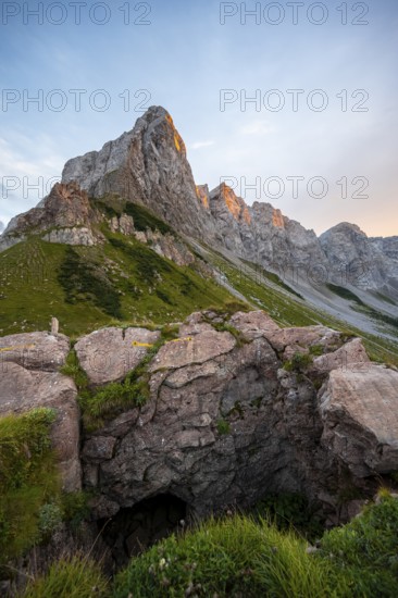 Alpenglow at Seekopf or Monte Capolago, old war tunnels and tunnels on the Carnic Ridge, mountain landscape with green meadows and rocky mountain peaks at sunset, Carnic Alps, Carnic High Trail, Carinthia, Austria
