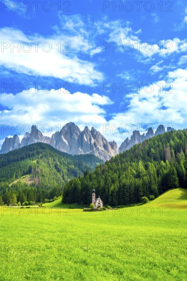 Surrounded by lush meadows and forests, st. Magdalena church sits in val di funes with the odle mountains towering in the background