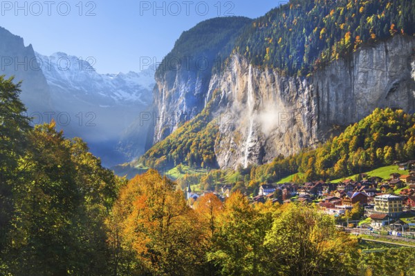 View of town and valley with Staubbach waterfall in autumn, Lauterbrunnen, Bernese Oberland, Canton of Bern, Switzerland