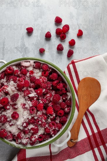 Fresh raspberry berry, covered with granulated sugar, jam preparation, top view, no people