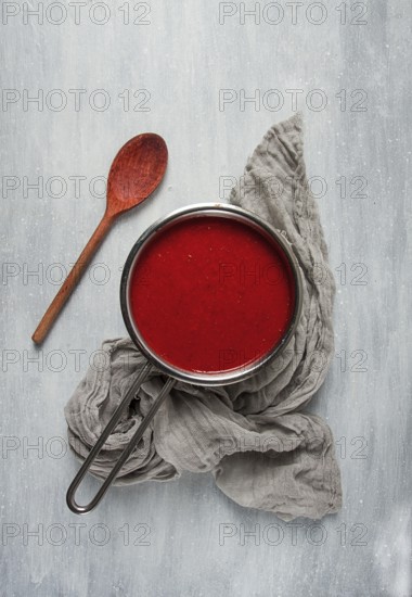 Tomato sauce with pepper and spices, Satsebeli, Georgian cuisine, red sauce, top view, homemade, no people, on a gray background