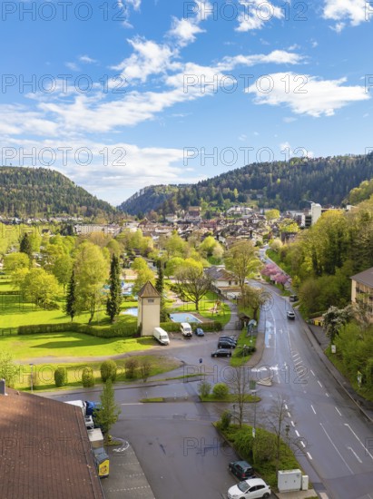 Idyllic town view with mountains, green meadows and blue sky, Bad Liebenzell, district of Calw, Black Forest, Germany