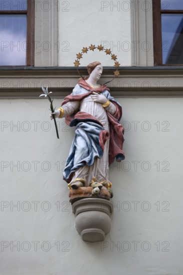 Figure of a saint on a town house, Bad Kissingen, Lower Franconia, Bavaria, Germany