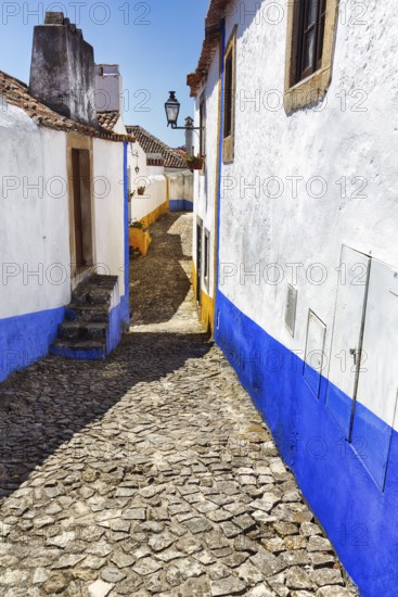 Typical alley in the medieval village of Óbidos, Portugal