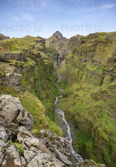 Mountain landscape with green canyon, waterfall and river in Múlagljúfur Canyon, Sudurland, Iceland