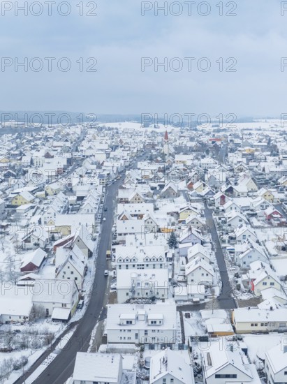 Small settlement under snow cover with straight main road, Deckenpfronn, Böblingen district, Germany