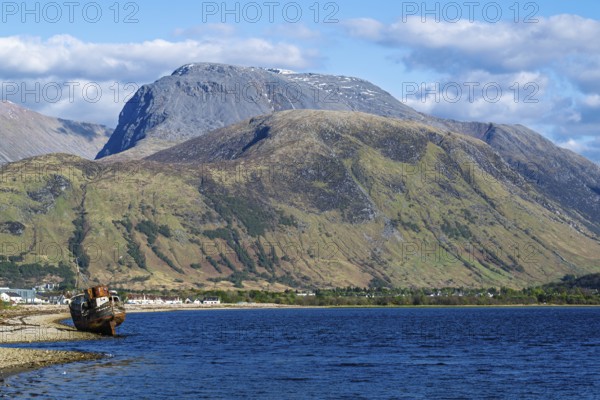 Corpach Wreck or Old Boat of Caol and Nevis Range Mountains, Caol Beach, Corpach, Fort William, Highland, Scotland, UK