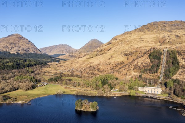 Aerial view, hydro-electric power station at Inveruglas, wooden pyramid viewing point on peninsula, Lake Lomond, Scotland, United Kingdom