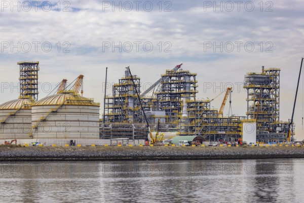 A bio-refinery is being built here. Construction site of the Finnish oil company Neste. Maasvlakte 2 deep-sea harbour on artificial land. Rotterdam, Zuid-Holland, Netherlands