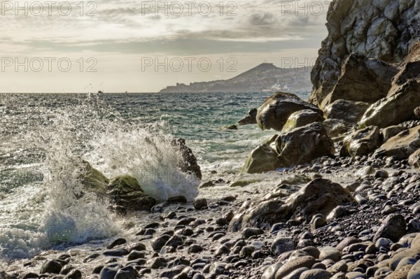 On the beach of Garajau, Ponta do Garajau stone beach, bathing beach, waves, surf, cliffs, Garajau, municipality of Santa Cruz, Madeira, Portugal