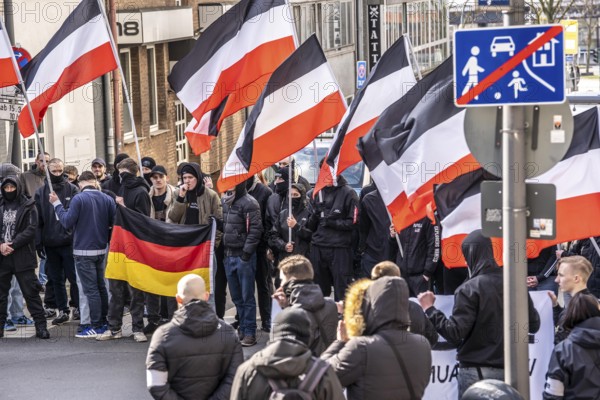 The neo-Nazi group Jung und Stark, JS, demonstrates in the city centre of Essen, demanding the remigration of foreigners, chanting Deutschland den Deutschen Ausländer raus, approx. 150 ultra right-wingers, dressed in black and wearing typical scene clothing, several groups demonstrate against the Nazi march, Essen, North Rhine-Westphalia, Germany