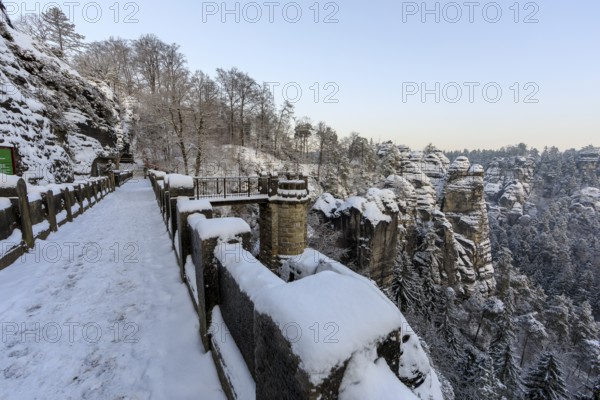 Winter on the Bastei Bridge with a view of the Ferdinandstein and the Wehlgrund, Saxon Switzerland, Saxony, Germany