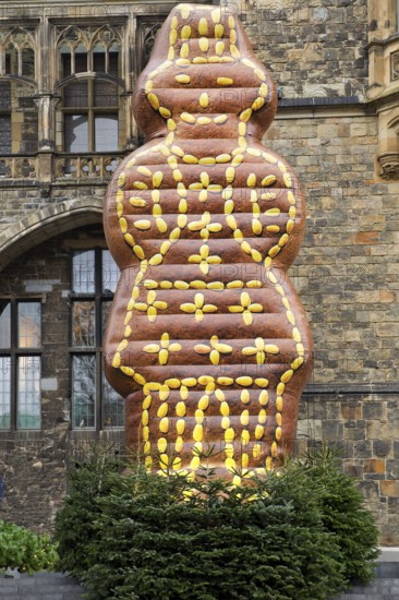 Artificial Printenmann in front of the town hall as a landmark at the Christmas market, Aachen, North Rhine-Westphalia, Germany