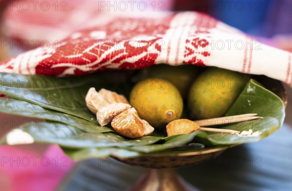 Assamese traditional food Tamul-paan (areca nut and betel leaves) at a stall during Magh Bihu or Bhogali Bihu festival. Magh Bihu or Bhogali Bihu is a harvest festival which marks the end of the harvesting season in Assam