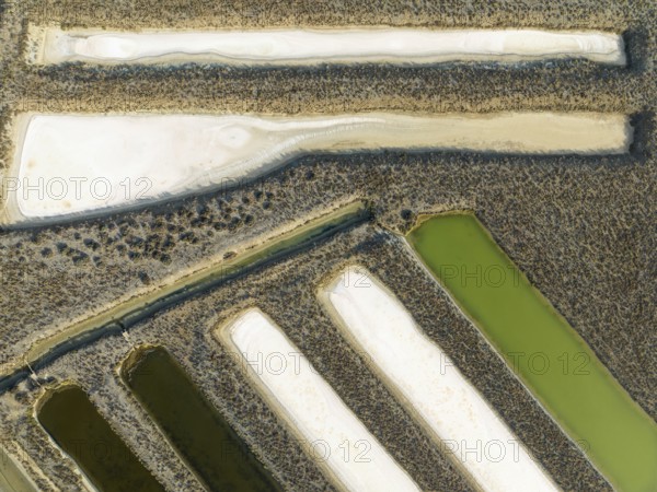 Saline ponds at the salt works near Chiclana de la Frontera. Aerial view. Drone shot. Cádiz province, Andalusia, Spain