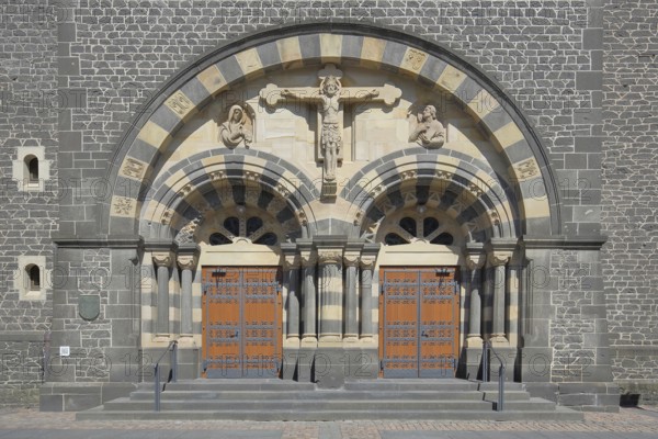Portal with crucifix of the Herz-Jesu-Kirche built in 1912, church door with fittings, church portal, two, decorations, Mayen, Vulkaneifel, Eifel, Rhineland-Palatinate, Germany