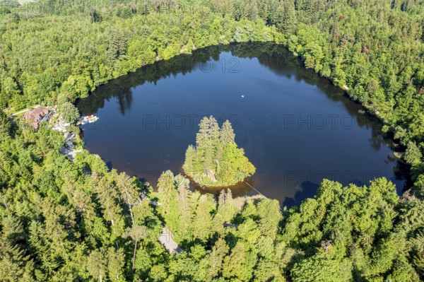 Lake Bergsee ('mountain lake') near Bad Säckingen, island in the lake, boat dock of rental boats, Rhine valley, Germany