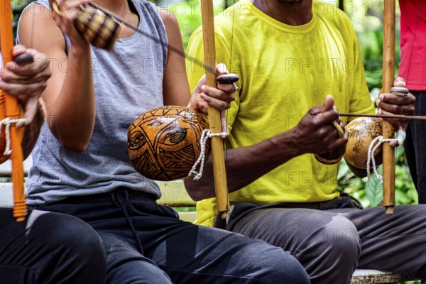 Berimbau players in capoeira performance in Brazil, Brazil