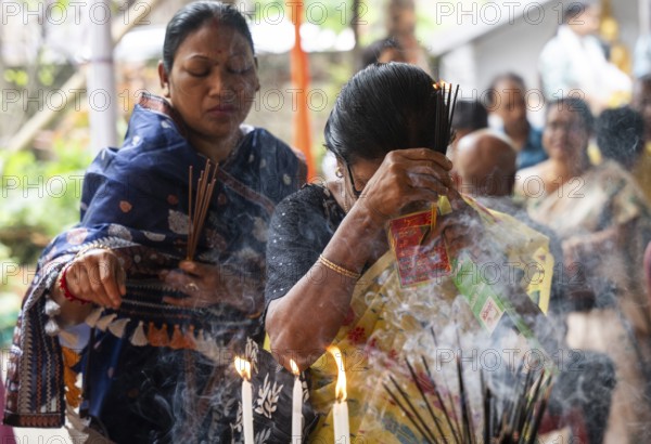 Devotees pray to Lord Buddha on the occasion of Buddha Purnima or Vesak Day that commemorates Gautam Buddha's birth anniversary, at a monastery in Assam, India on 12 May 2025
