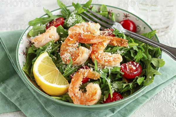 Shrimp salad with arugula and cherry tomatoes, with parmesan cheese, healthy food