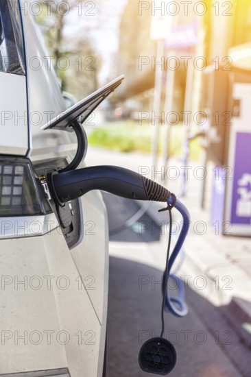 Charging the battery of an electric car with electricity E-car at an electric petrol station petrol pump in Stuttgart, Germany