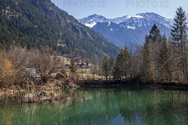 Small lake near Hinterstein, behind mountains of the Allgäu Alps, Bad Hindelang, Oberallgäu, Allgäu, Bavaria, Germany