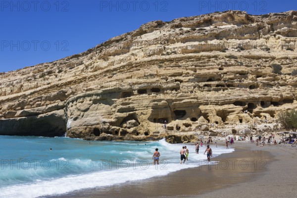 Matala beach with a view of the rock caves, south coast, Crete, Greece
