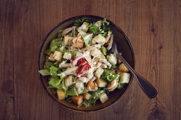 Classic Caesar salad, close-up, natural light, selective focus, horizontal