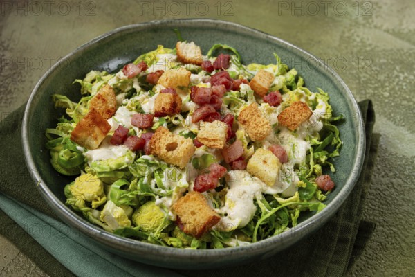 Brussels sprouts Caesar salad, with bacon and croutons, healthy food, homemade, no people