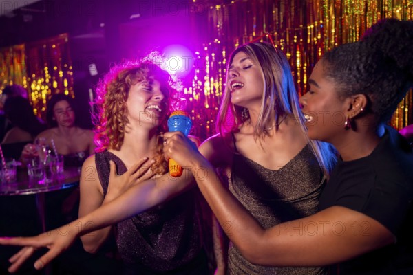 Group of female friends enjoying karaoke night, singing with passion and having fun together in vibrant nightclub atmosphere