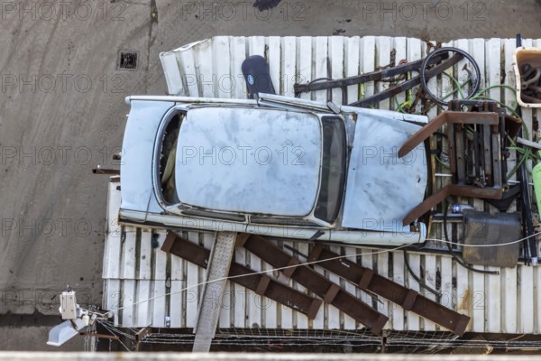 Metals are stored in a scrapyard in the harbour: scrap metal is a valuable raw material for recycling. Including a scrap-ready Trabant vehicle. Mannheim, Baden-Württemberg, Germany