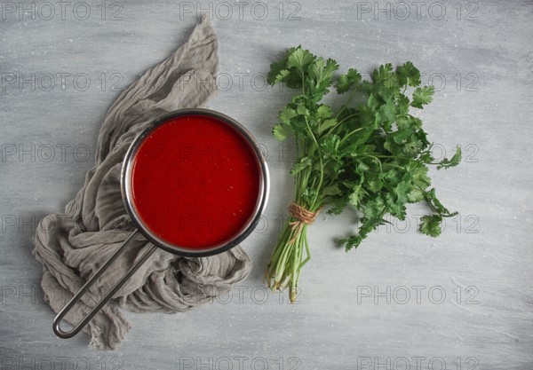 Tomato sauce with pepper and spices, Satsebeli, Georgian cuisine, red sauce, top view, homemade, no people, on a gray background