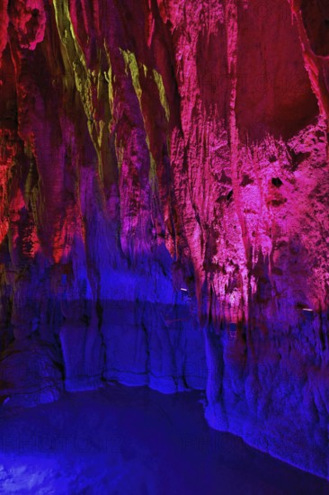 Stalactites illuminated by coloured light, stalactite cave, Höllgrotten, Baar, Canton Zug, Switzerland