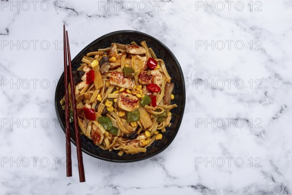 Fried noodles with chicken meat and vegetables, Bami Goreng, Indonesian dish, no people