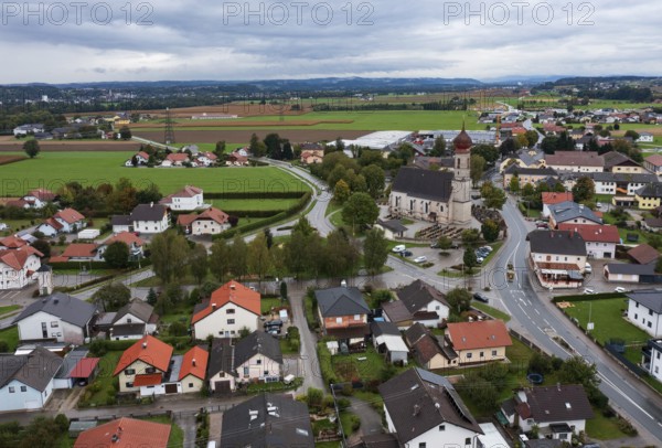 Drone shot, view of village with church, Burgkirchen, Innviertel, Upper Austria, Austria