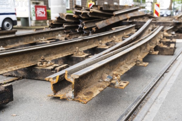 Construction site of a tram line, tracks and railway sleepers are being replaced and lie stacked on the road, Düsseldorf, Germany