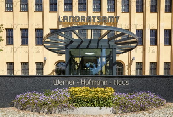 Former porcelain factory, today district administration office, entrance area with lettering Werner-Hofmann-Haus, Freiberg, Saxony, Germany