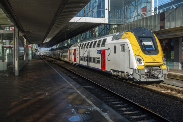 Passenger train at empty platform in the Gent-Sint-Pieters railway station in Ghent during public transportation strike, East Flanders, Belgium