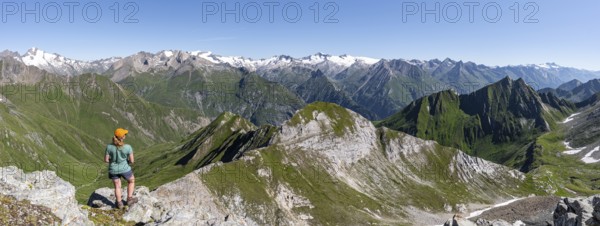 Mountaineer in front of mountain panorama with Großvenediger, mountain landscape with mountain peaks of the Venediger group, view from the summit of the Gösleswand, Lasörling group, Hohe Tauern National Park, East Tyrol, Tyrol, Austria