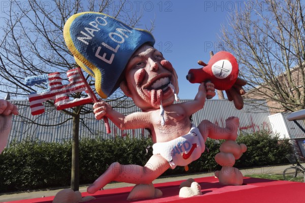 Elon Musk with Napoleon hat, wearing nappy trousers with AfD logo, papier-mâché figure, themed float by Jacques Tilly, Rosenmontagszug 2025, Düsseldorf, Rhineland, North Rhine-Westphalia, Germany