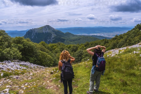 Mount Aizkorri 1523 meters, the highest in Guipuzcoa. Basque Country. Two friends on the trail to the top of Mt. Ascent through San Adrian and return through the Oltza fields