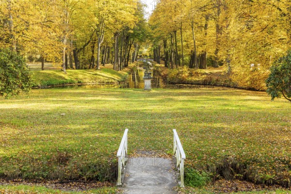 Castle park of Hermsdorf Castle with castle moat in autumn, Ottendorf-Ockrilla, Saxony, Germany