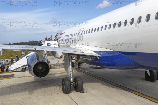 Passengers boarding British Airways Airbus A320 plane, Aeroporto Francisco Sa Carneiro, Porto airport, Portugal