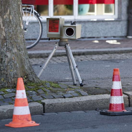 Radar measuring device device on a tripod at the edge of the pavement for speed monitoring in public road traffic, speed camera, Goslar, Lower Saxony, Germany