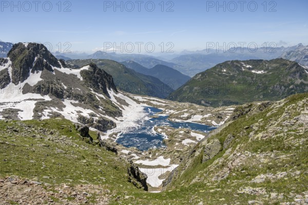 View of mountain lake Lac Cornu, mountain landscape, Aiguilles Rouges, Chamonix-Mont-Blanc, Haute-Savoie, France